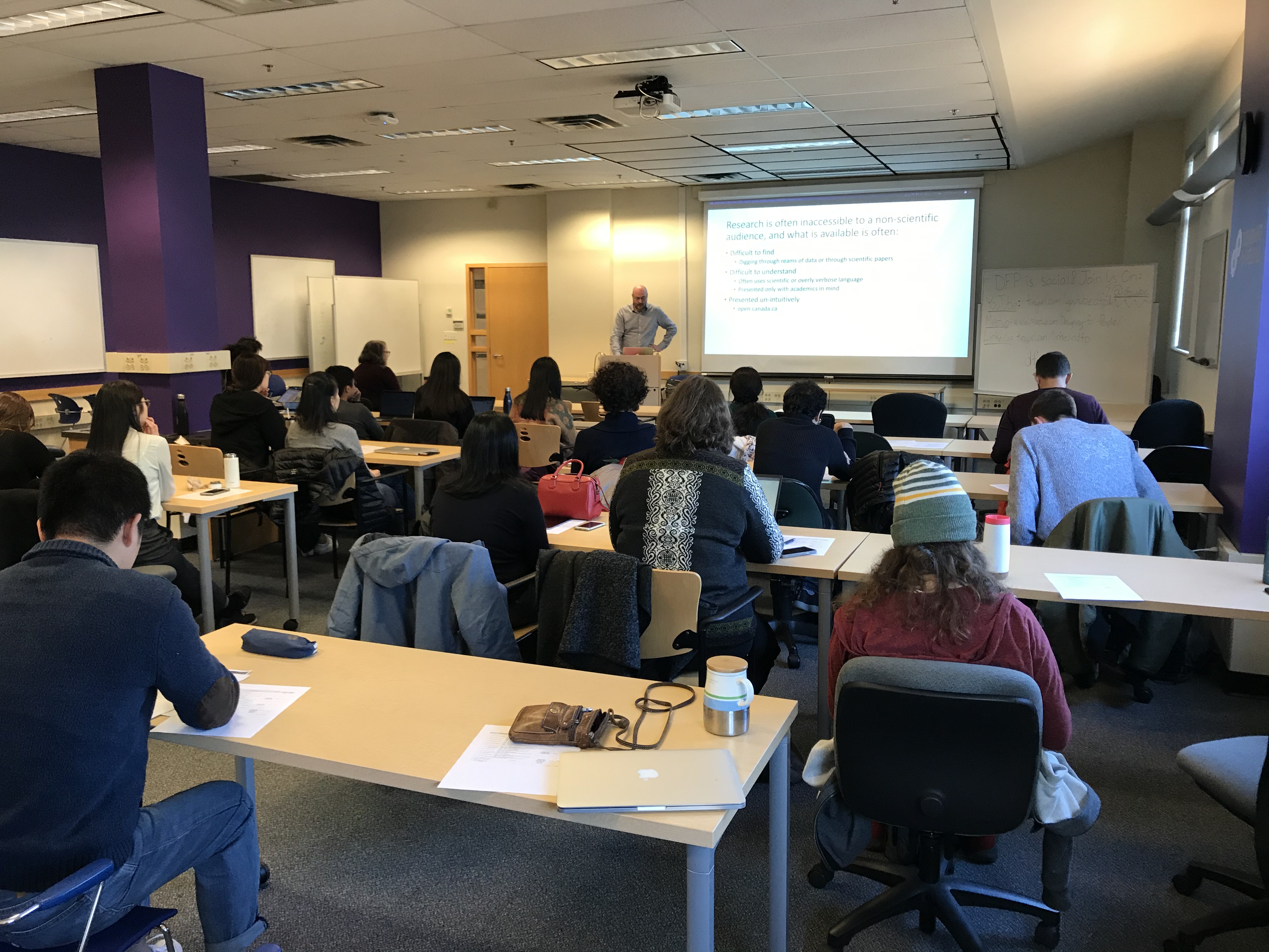 Speaker giving presentation to class